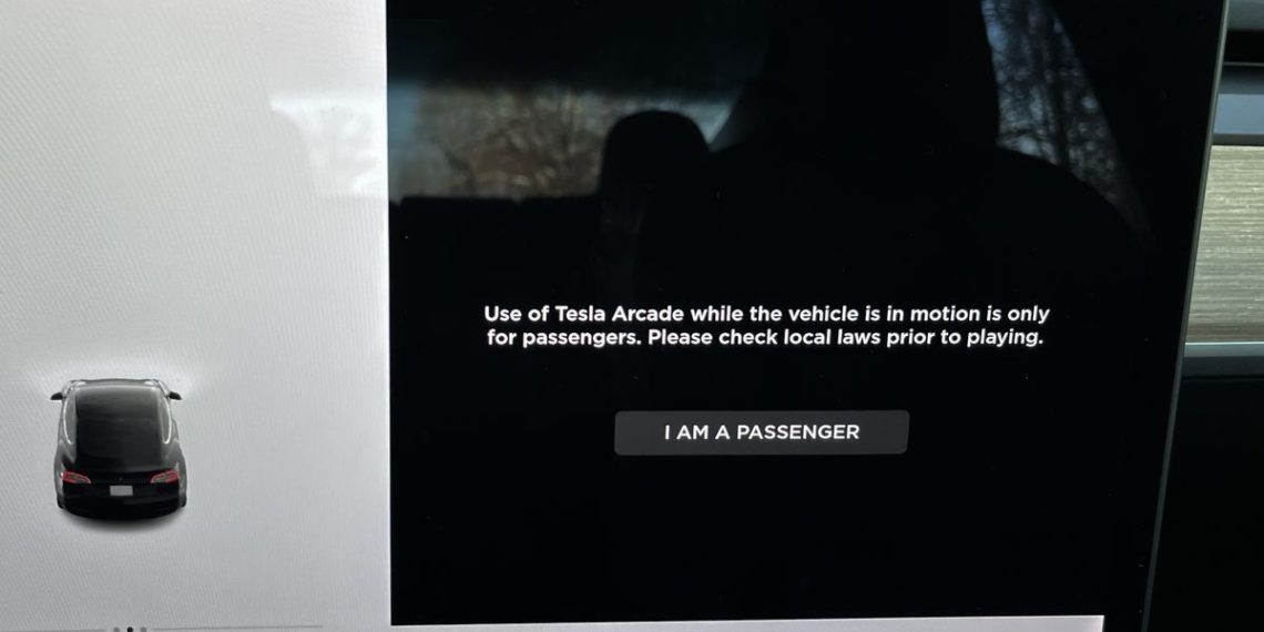 Tesla will stop letting people play games in cars that are moving