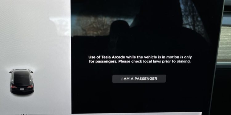 Tesla will stop letting people play games in cars that are moving