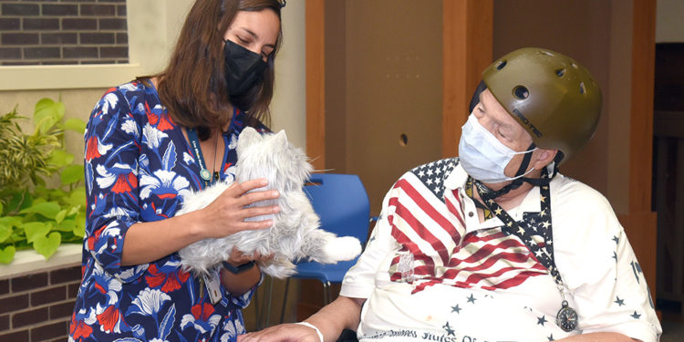 Robotic pets rekindle positive memories for resident Veterans