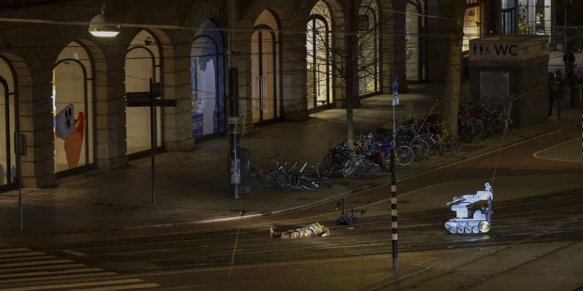 Apple Store hostage situation ends after hostage escapes, and police hit the suspect with a car