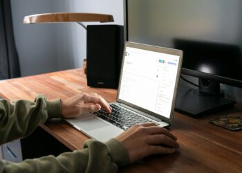 person typing on laptop