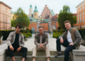 three men posing outdoors