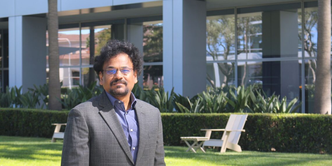 man wearing glasses posing outdoors