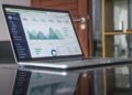 laptop on glass table