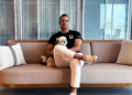 man sitting with legs crossed