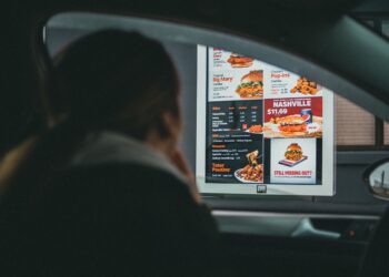 man ordering at a drive thru